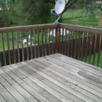 Natural-wood deck greyed out by sun damage